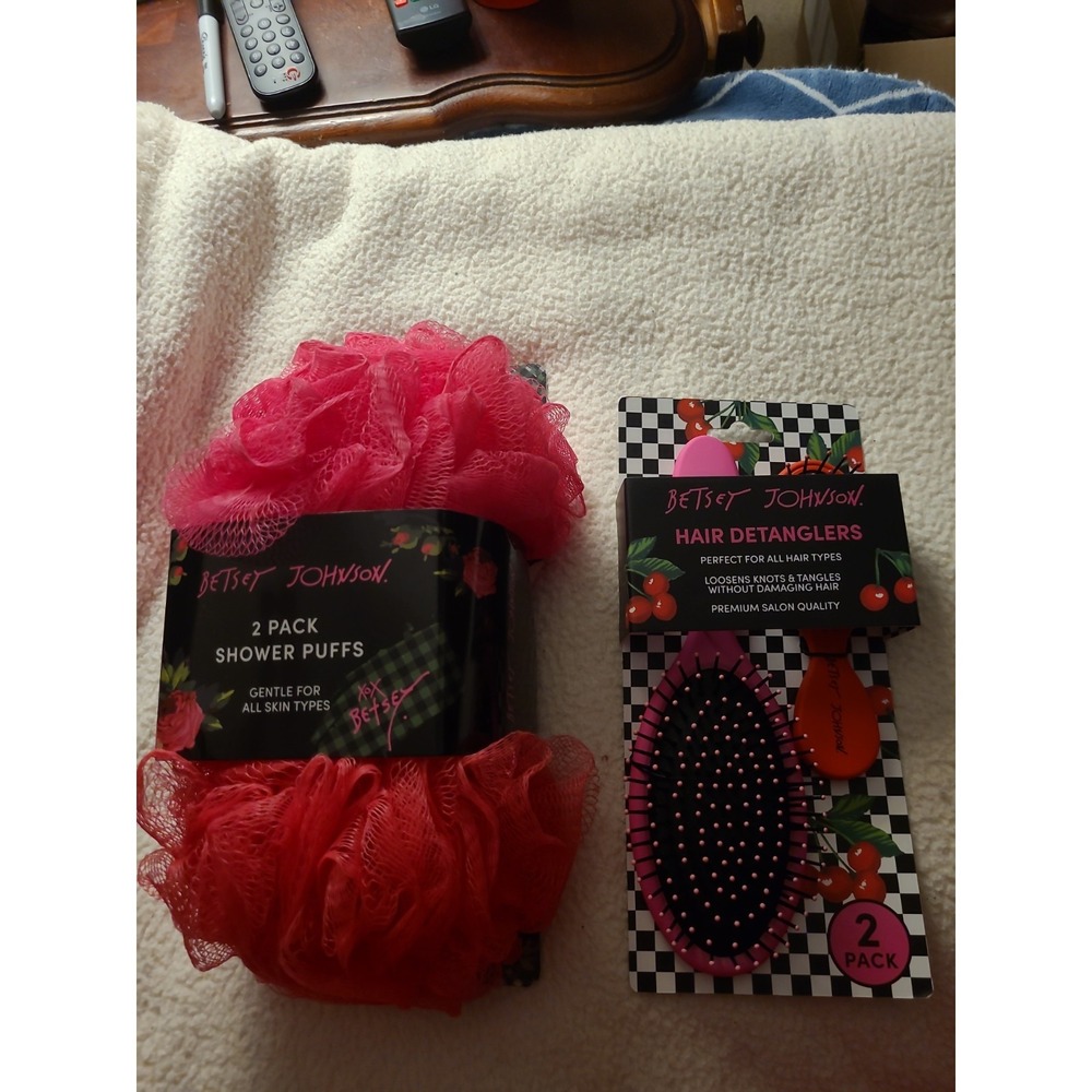 New in package Betsey Johnson 2 Pack hair brush detangulars, 2 shower puffs